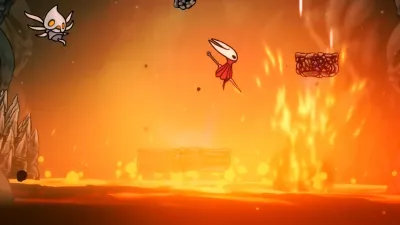 Hornet crossing lava platforms beneath the Grand Gate in the Blasted Steps